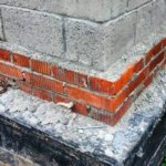 Step-by-step construction of a plinth made of blocks or bricks